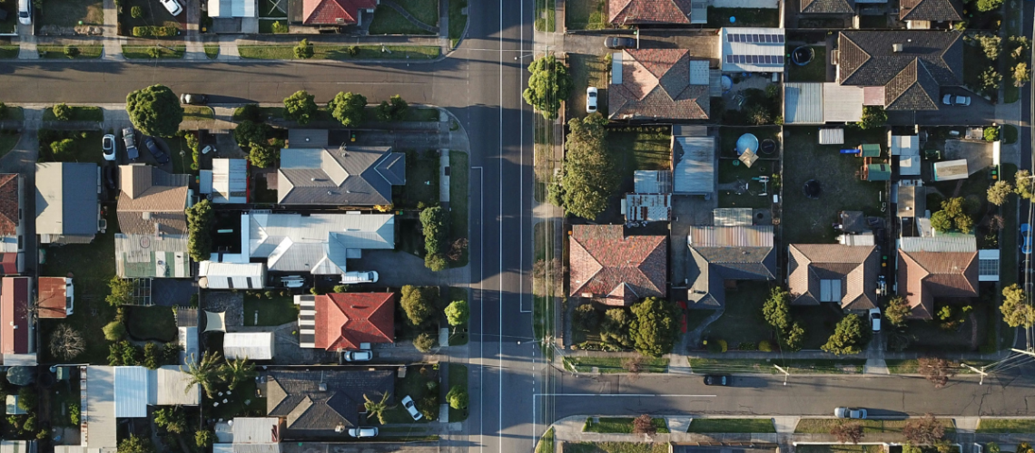 Arial shot of a Melbourne, Australia neighbourhood with several visible rooftop solar panels. Photo by  Tom Rumble.